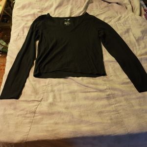 Long sleeved, black top.